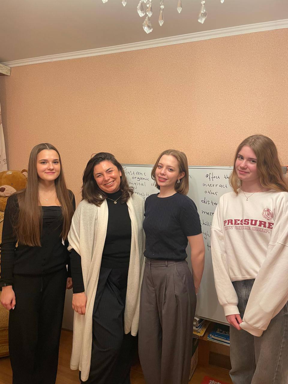 Anna with English students by the whiteboard