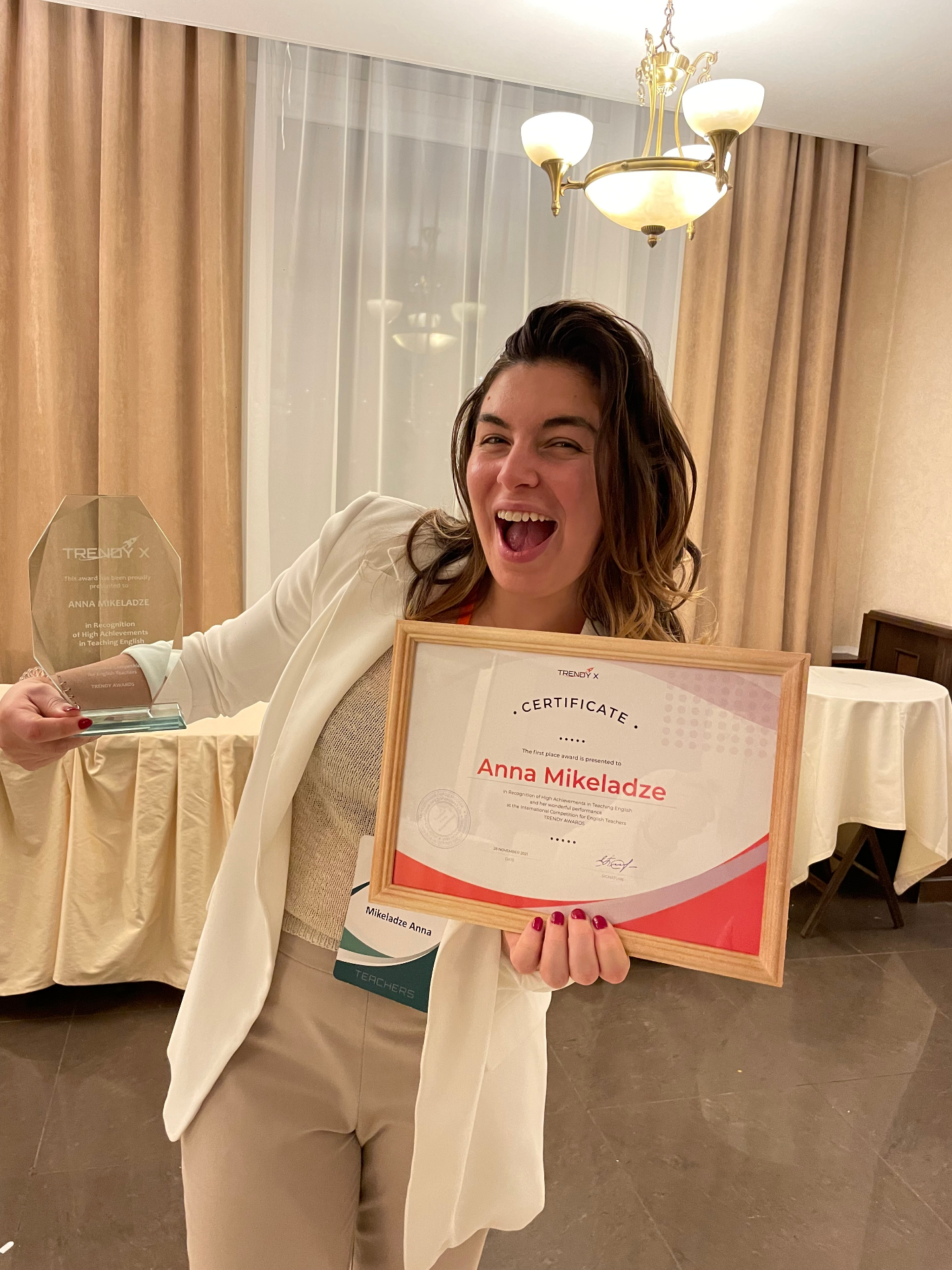 Anna Mikeladze receiving the TRENDY X first place award for high achievements in teaching English
